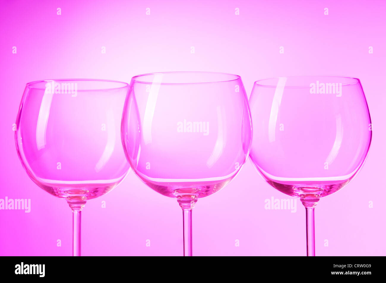 Wine glasses against gradient background Stock Photo