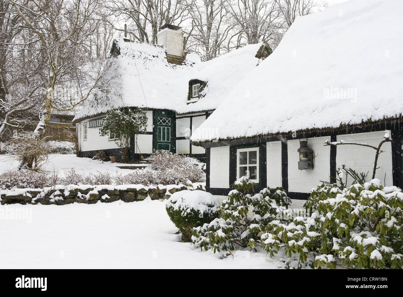 Thatched cottage in the winter Sieseby Stock Photo