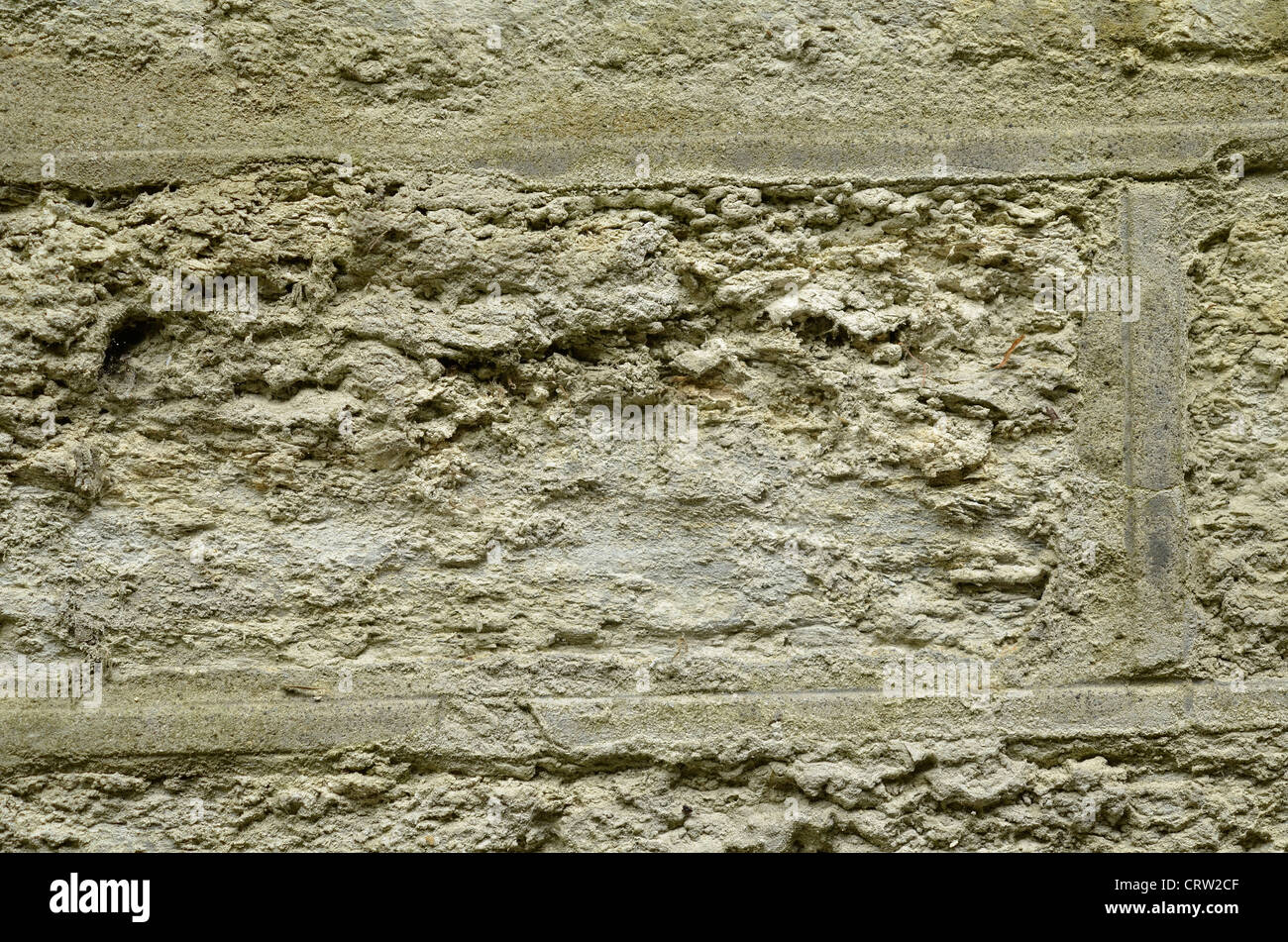 Detail of section of stone wall, showing signs of crumbling texture. Stock Photo