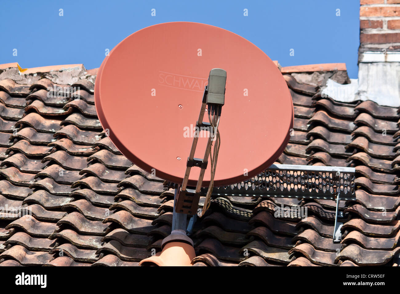 satellite dish on a house roof Stock Photo Alamy