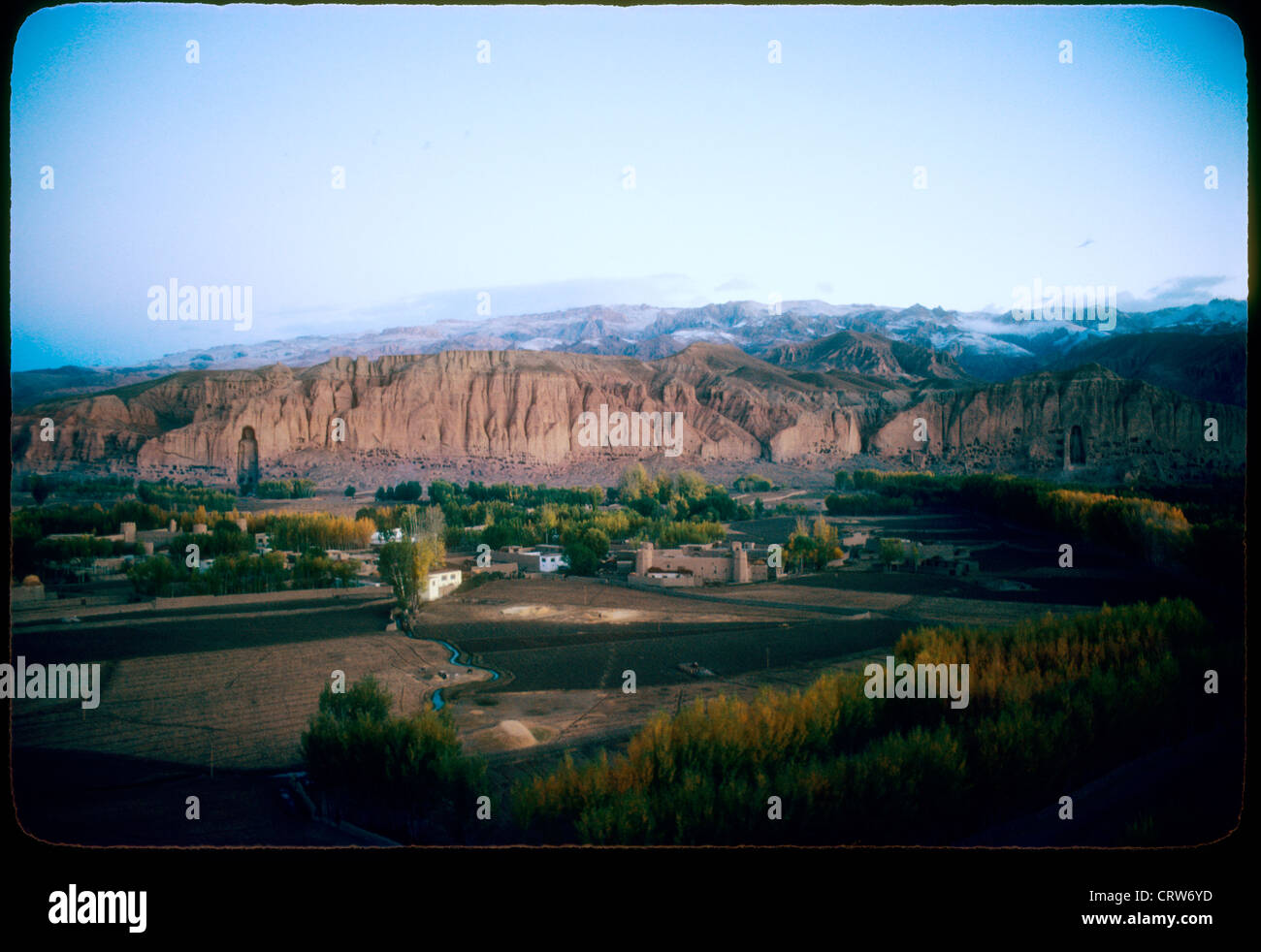 The Buddhas of Bamiyan the Hazarajat region of central Afghanistan before the Soviet Invasion. overall landscape mountains Stock Photo