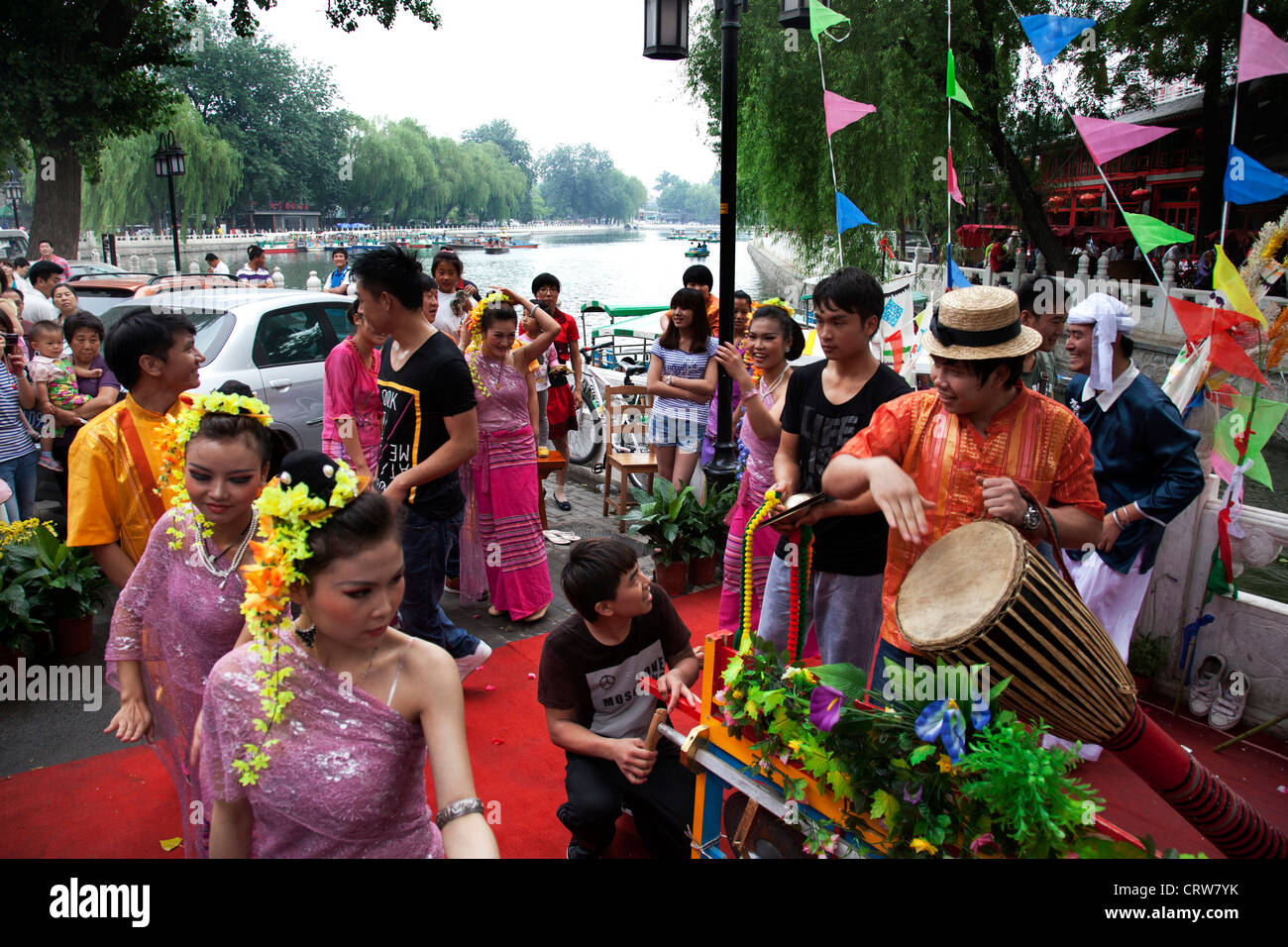 Traditional dancers dressed in beautiful costumes perform a dance on a day of cultural celebration in Shichahai area, Beijing. Stock Photo