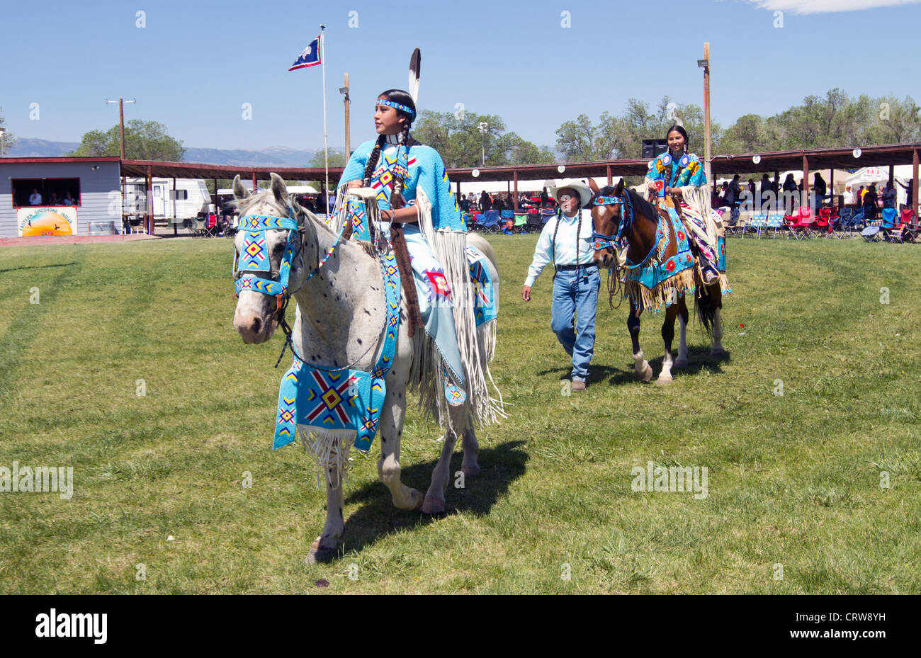 Riders arriving for a parade held during the Indians days at Fort