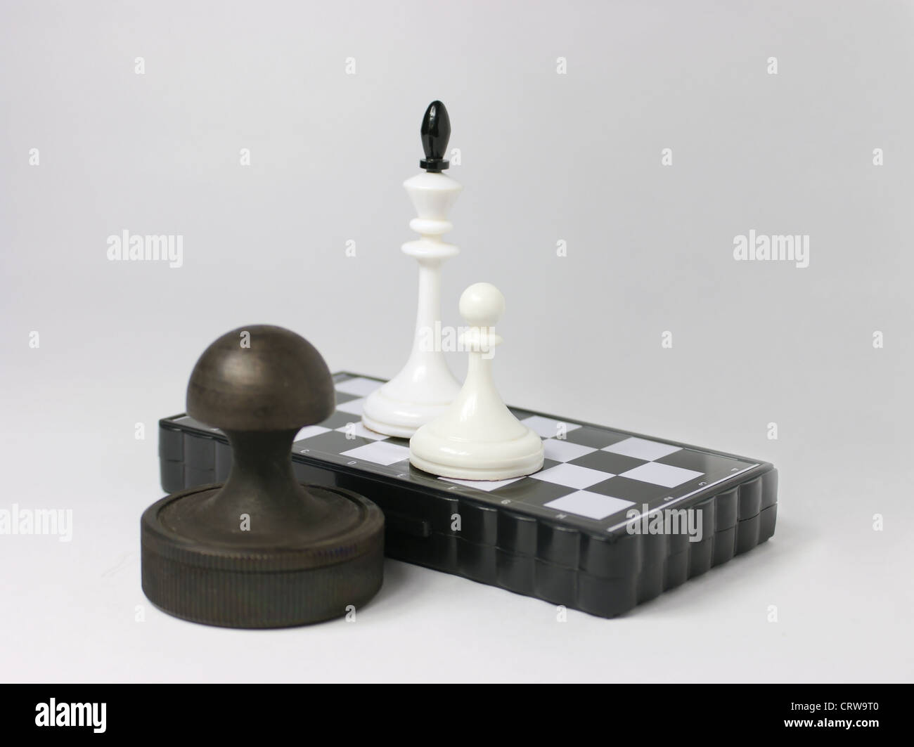 chess pieces on the board and stamp Stock Photo