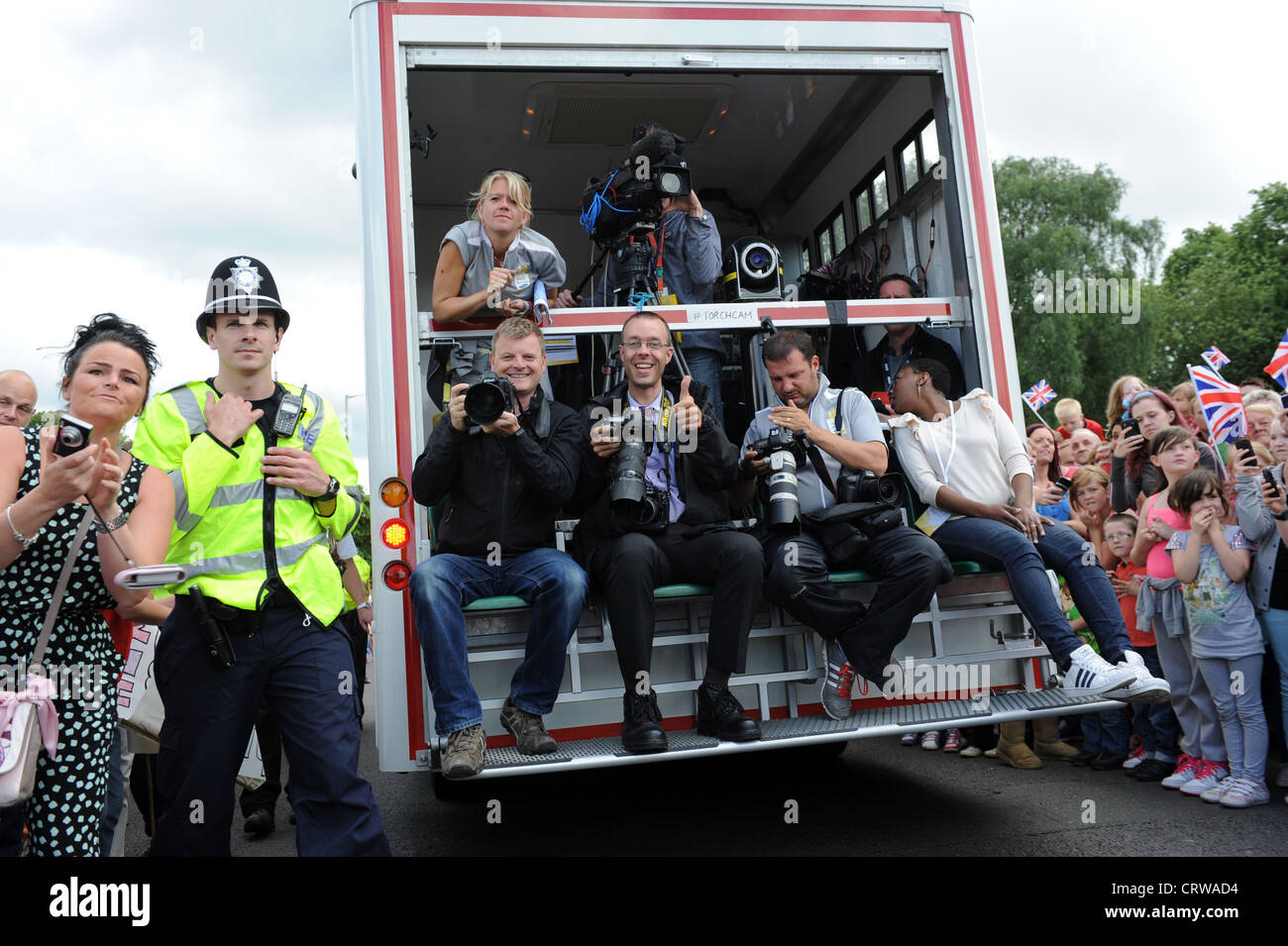 Photographers and video crews filming the Olympic Torch relay through the West Midlands Stock Photo