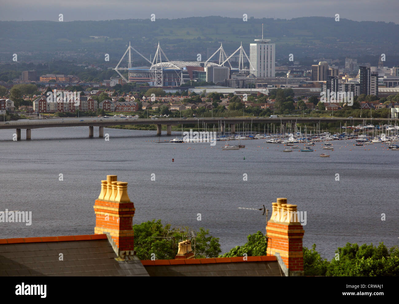 Millennium Stadium and the A4232 Grangetown Link, Cardiff as seen over chimneys in Penarth, Vale of Glamorgan south Wales Stock Photo