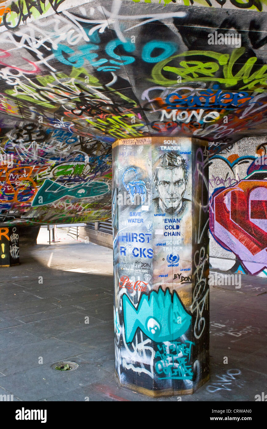 Urban graffiti street art vandalism on south bank London England Europe