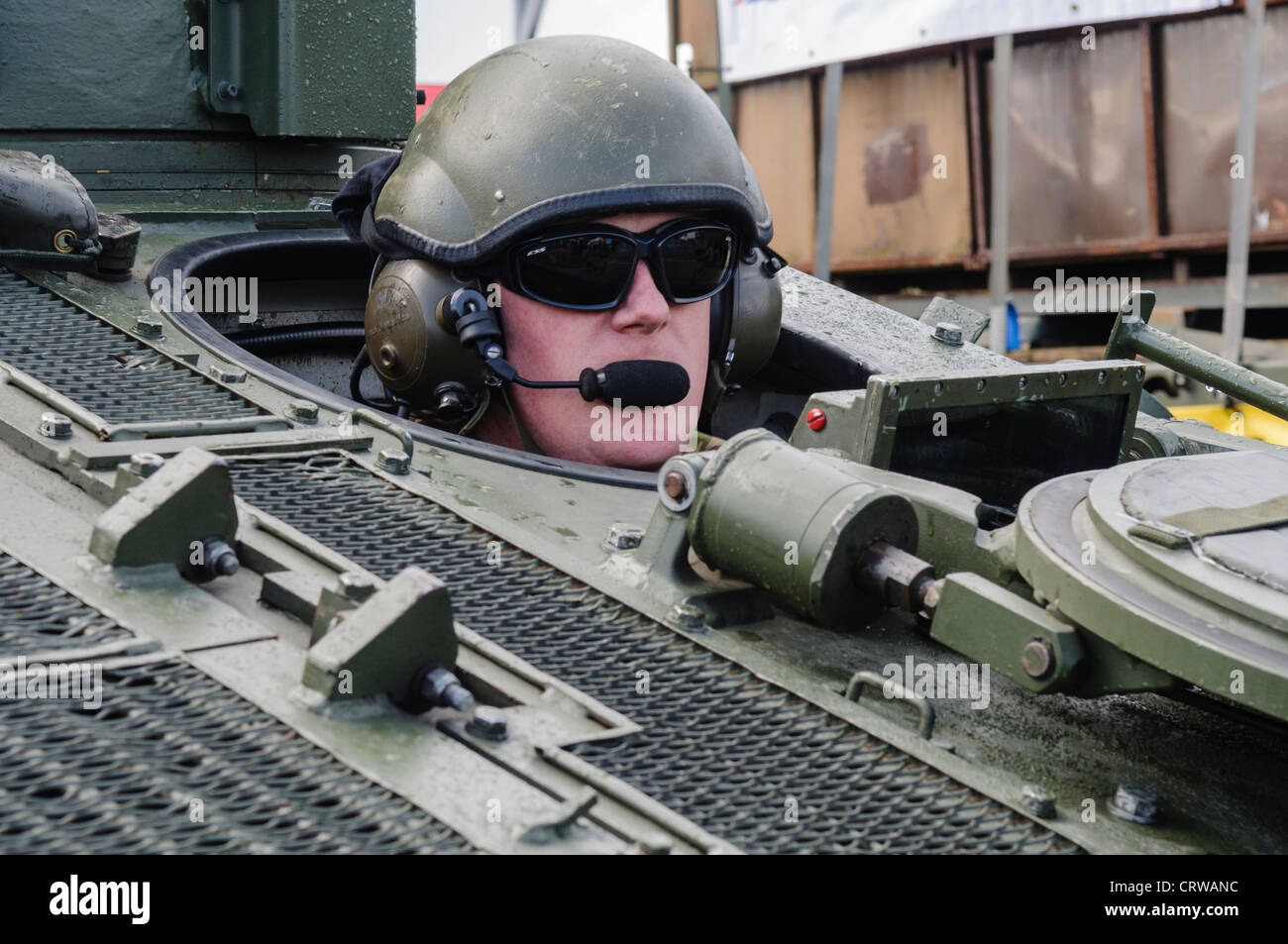 Soldier drives a Scimitar reconnaisance vehicle Stock Photo