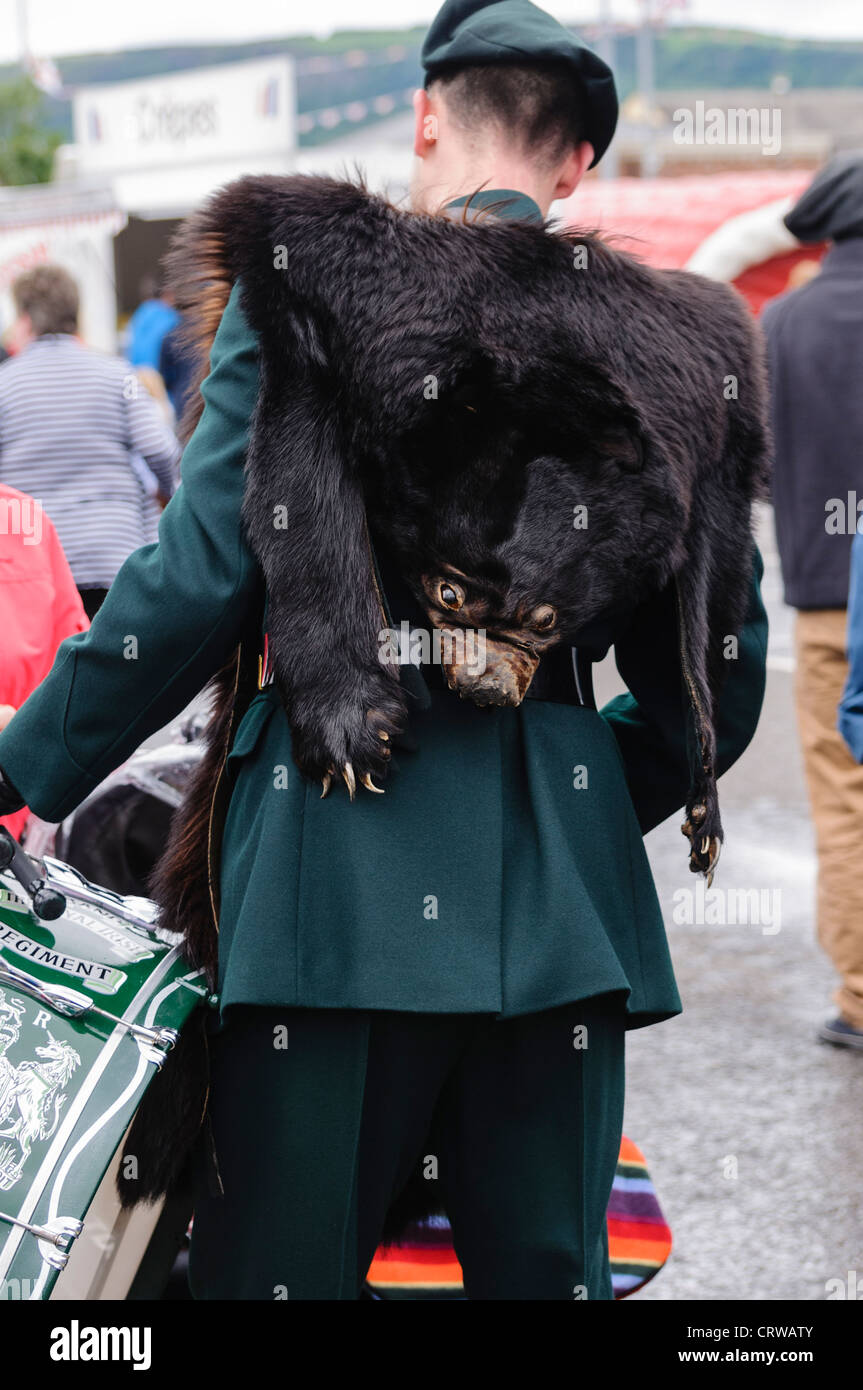 Member of a military band wearing a real bear skin Stock Photo