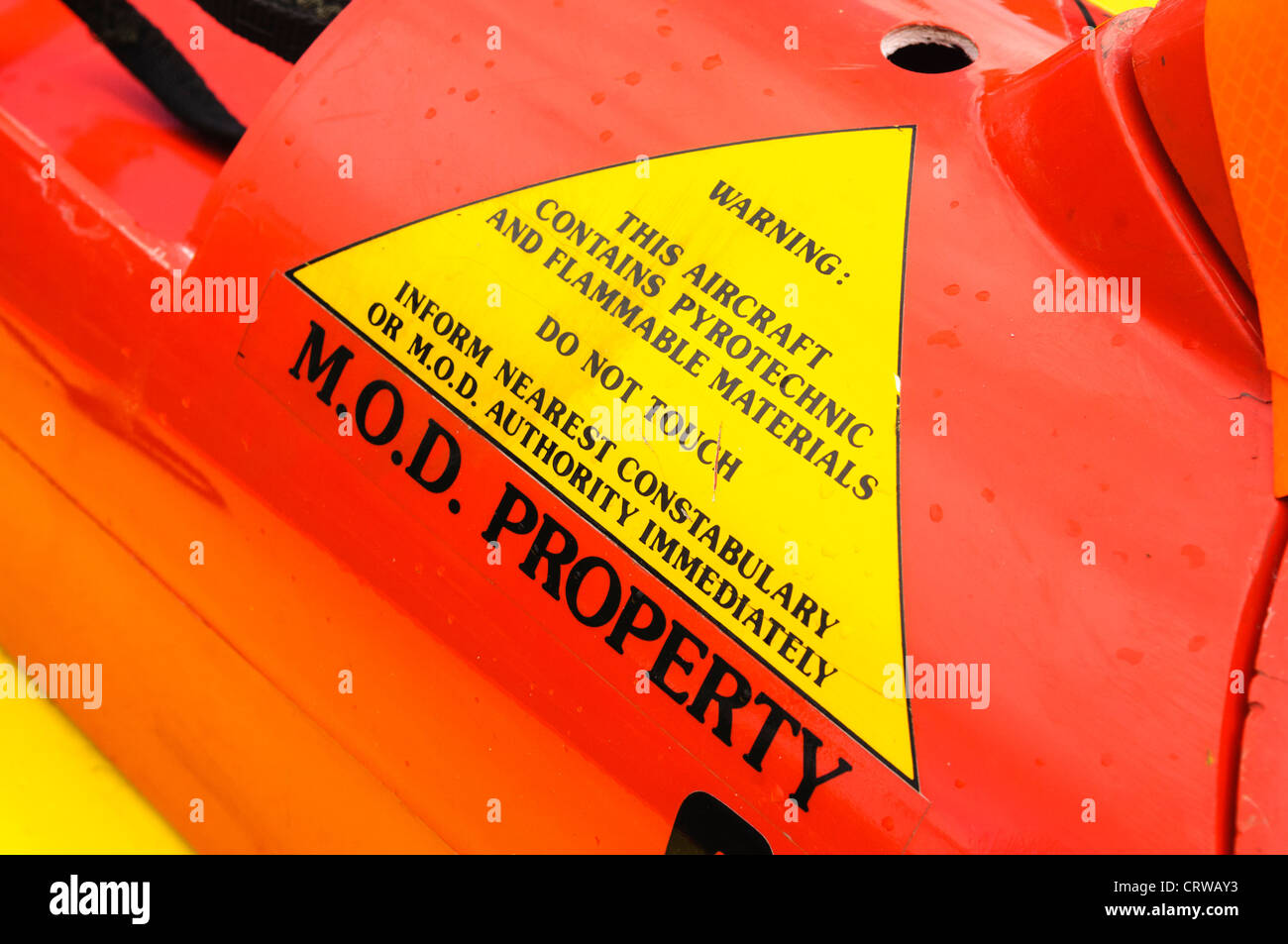 Sign on side of a MOD pilotless drone warning public to contact authorities if they find this vehicle Stock Photo