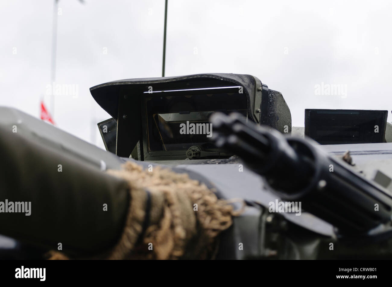 Drivers prism and heavy machine gun on a Fox FV721 armored reconnaissance vehicle Stock Photo
