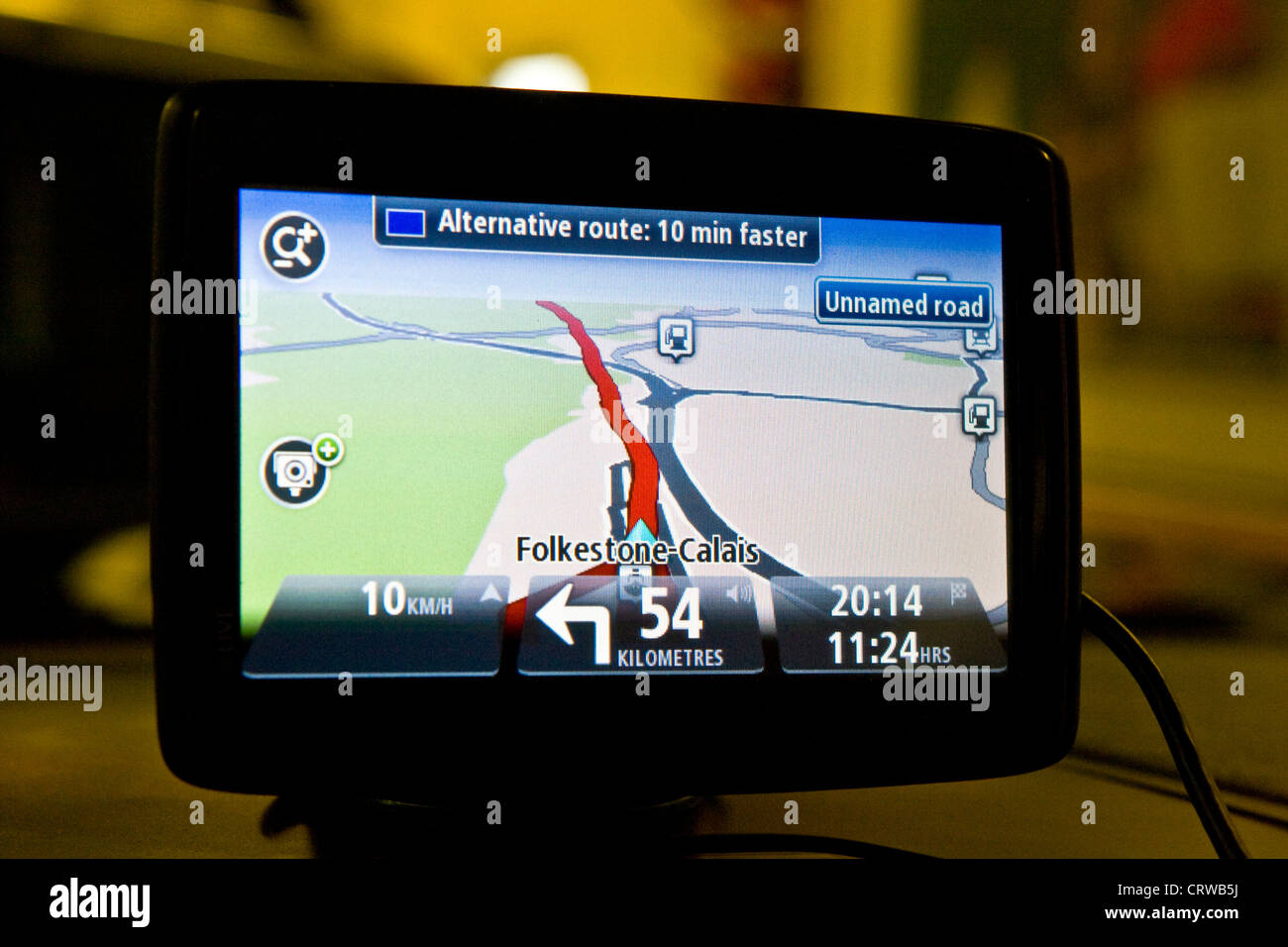 A GPS satellite navigation system and screen on a car dashboard, displaying the route from Folkestone to Calais Stock Photo