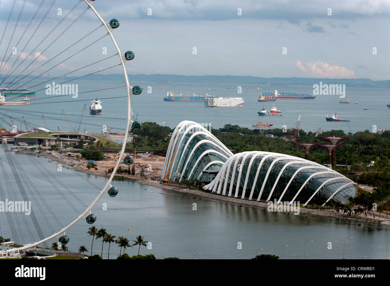 The flower dome behind the Singapor Flyer, Marina Bay, Singapore plus shipping. Stock Photo