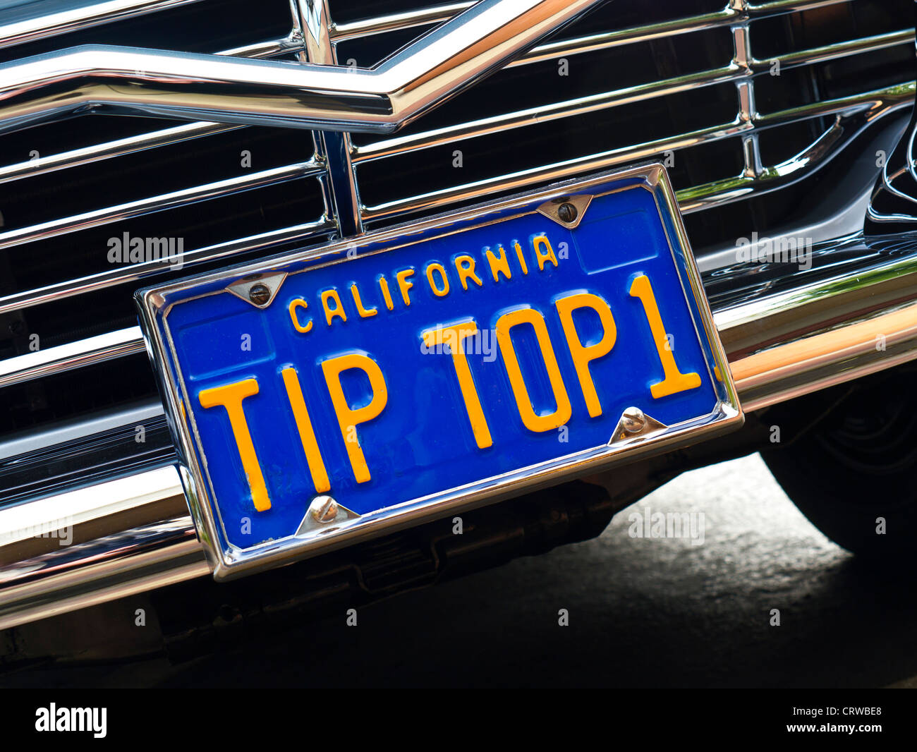 Tip Top 1 registration plate on glossy  chrome grill 1950's Ford Fairlane Skyliner American classic car Stock Photo