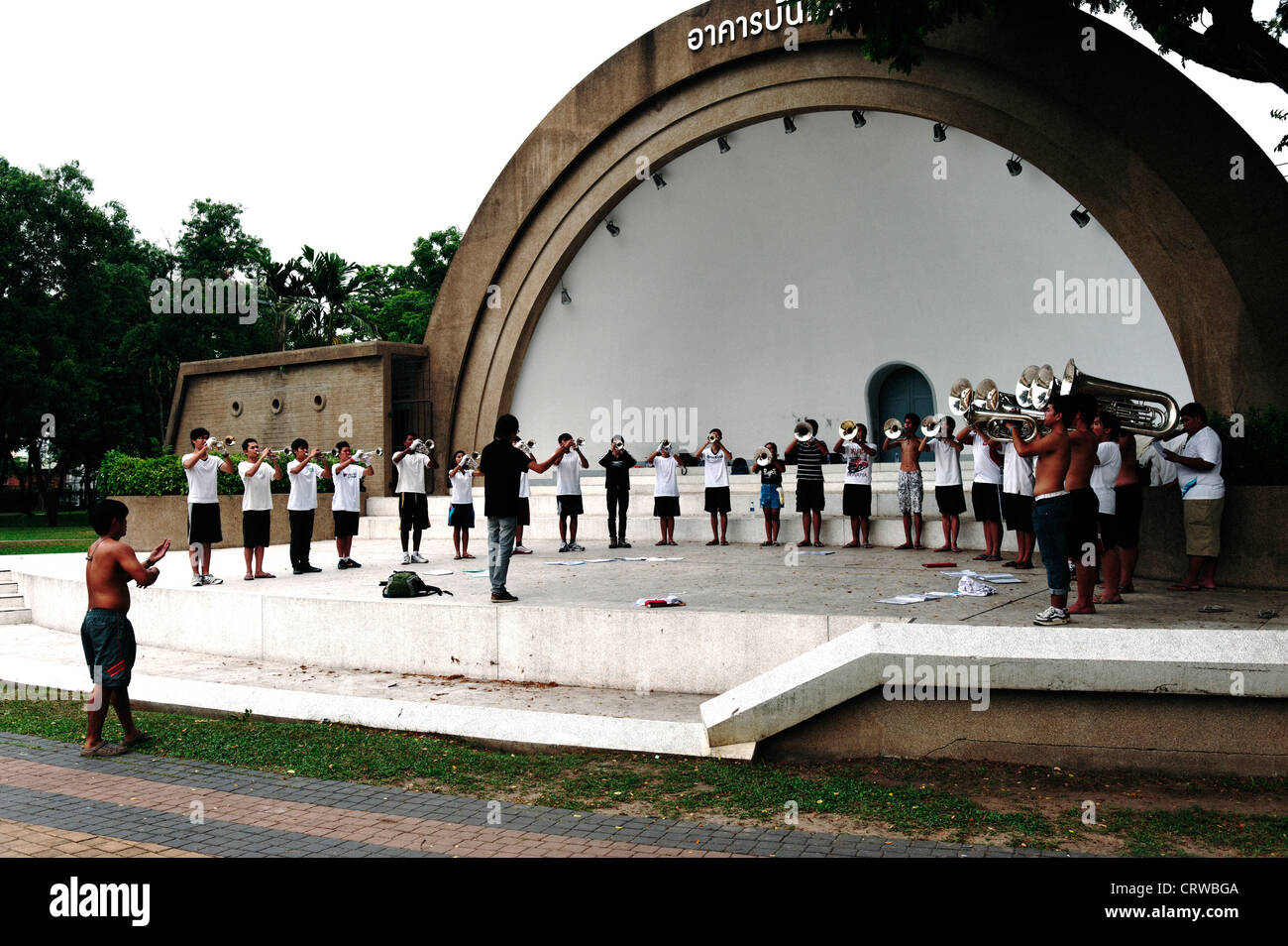 Group of young Thai boys and girls playing in a brass band in Lumpini