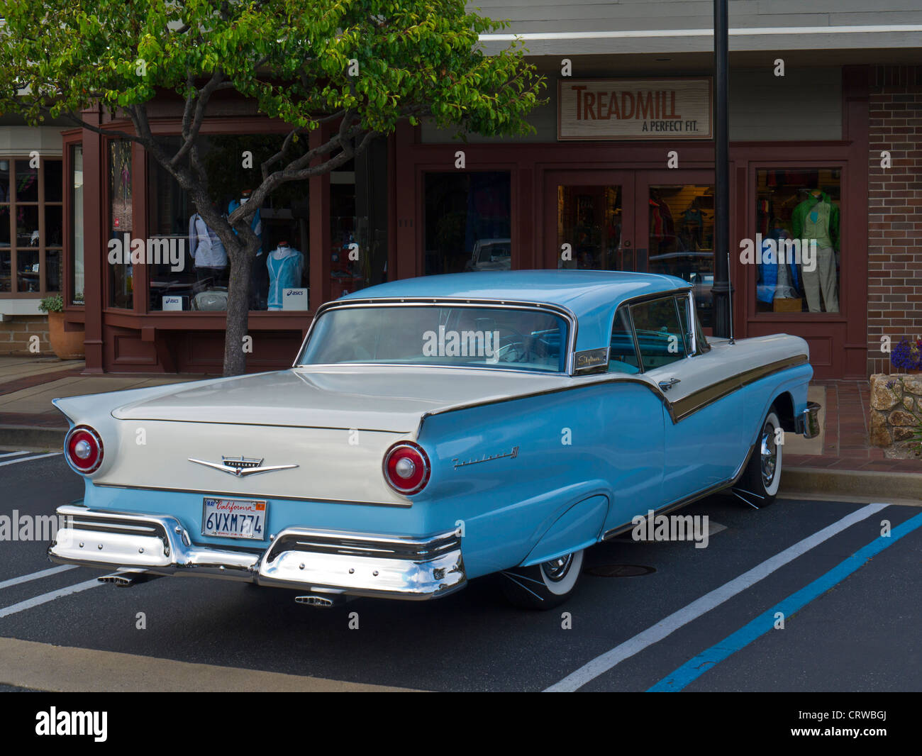 1950's Ford Fairlane Skyliner American classic motor car parked at Carmel California USA with harmonious colour surround Stock Photo