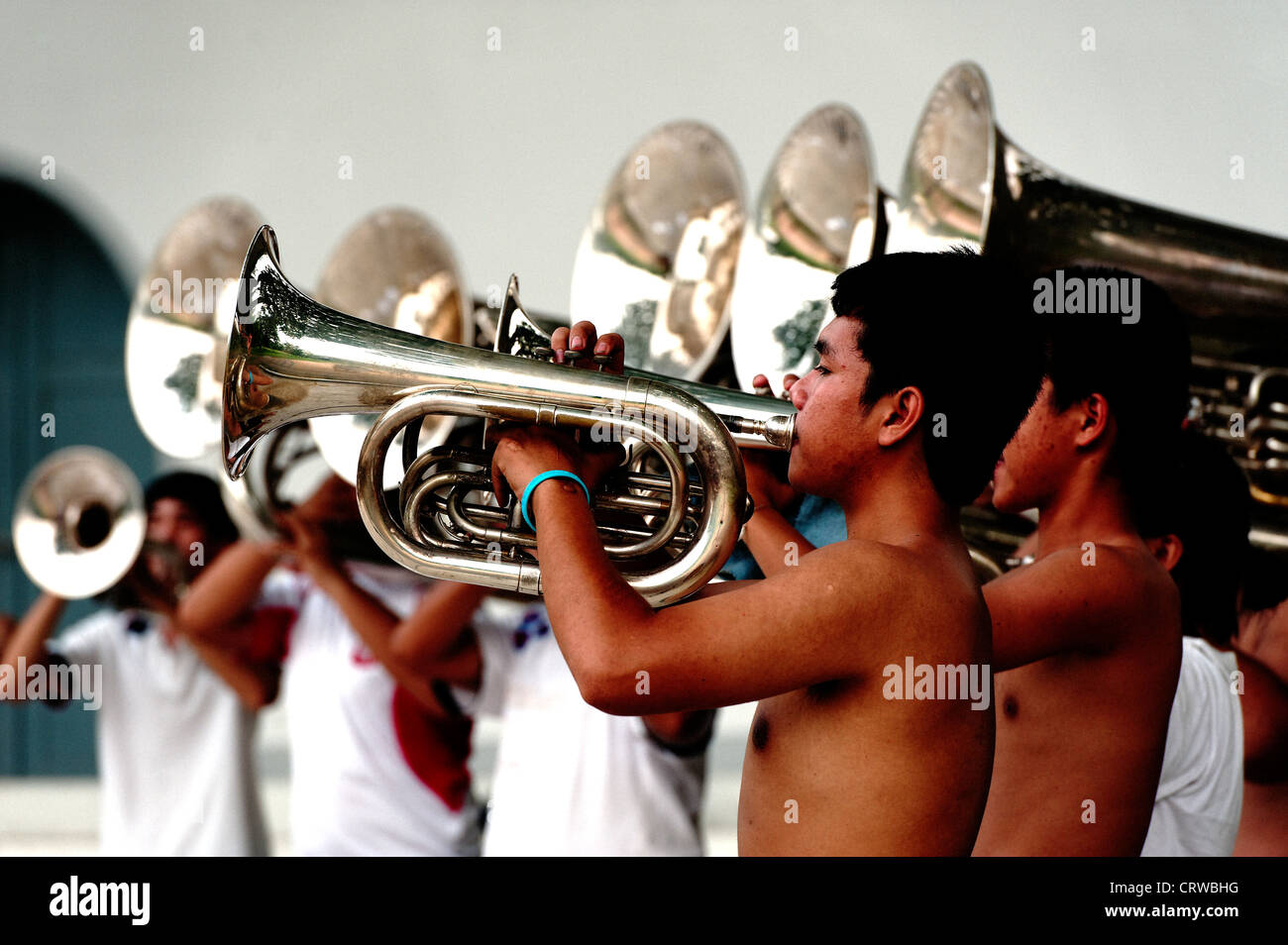 Group of young Thai boys and girls playing in a brass band in Lumpini