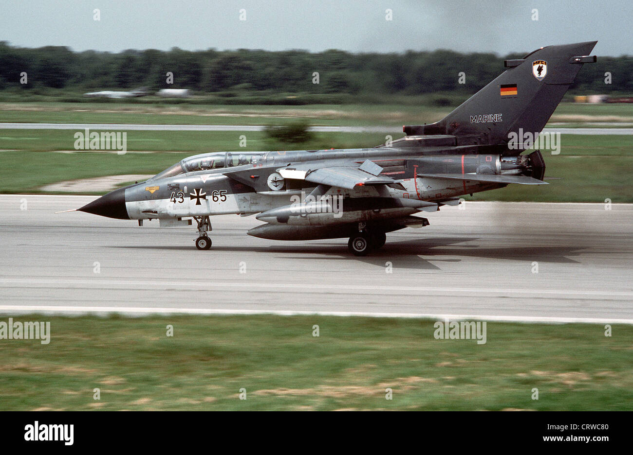 A Federal German Navy Panavia Tornado IDS aircraft (s/n 43+65) lands at Naval Air Station, Oceana, Virginia (USA), on 1 August 1989. The Tornado belonged to Marinefliegergeschwader 1 (MFG 1) (Naval Fighter Wing 1) at Jagel Air Base, Schleswig-Holstein (Germany). After the end of the cold war MFG 1 was disbanded in 1993. Note the thrust reversers. Stock Photo