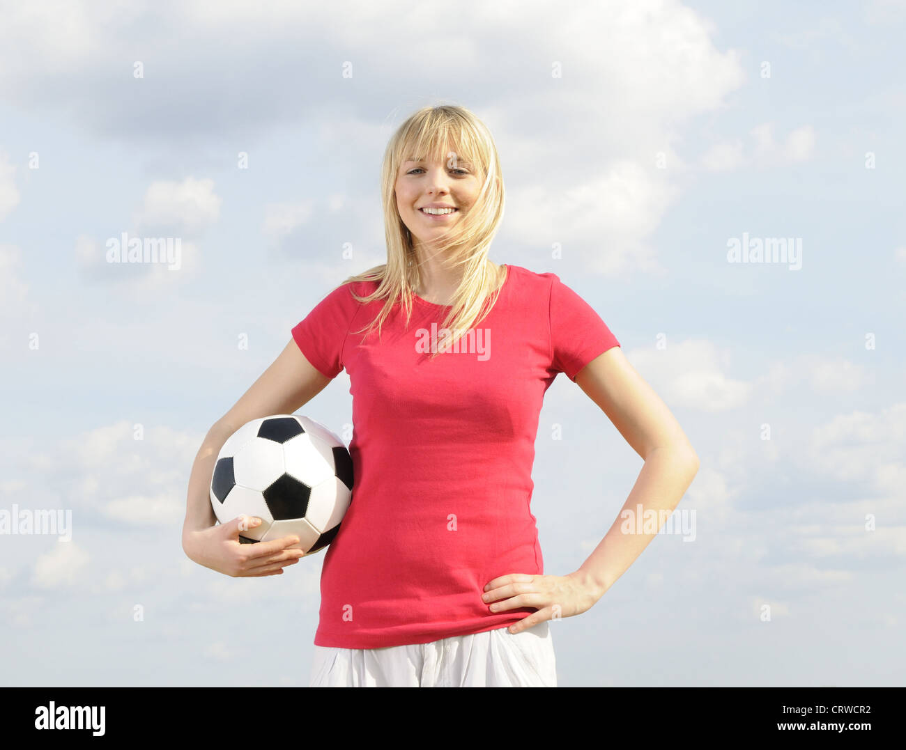 young woman with soccer ball Stock Photo