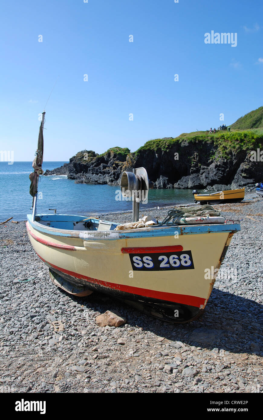 A small fishing boat on the shingle beach at Cadgwith in Cornwall, UK Stock Photo Alamy