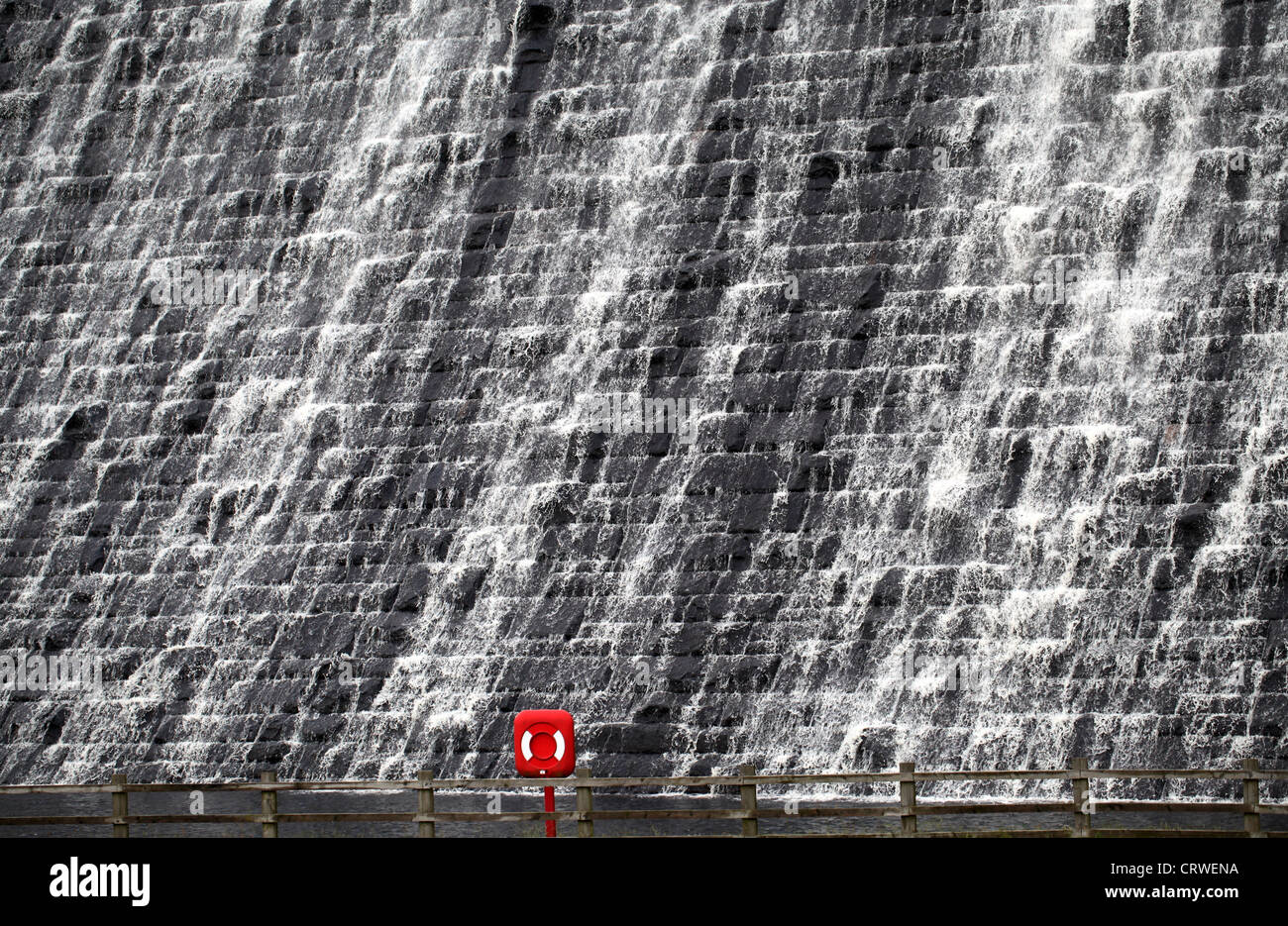 The Overflowing Dam Wall at Derwent Reservoir and Life Saving Equipment Stock Photo