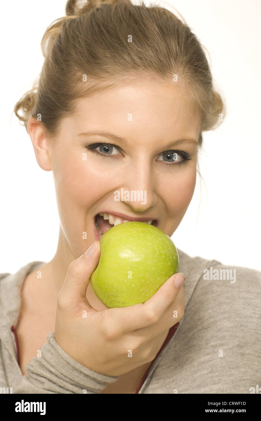 woman eats apple Stock Photo