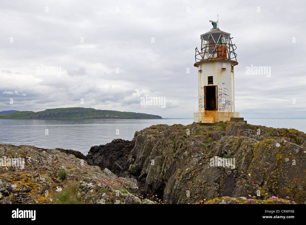 Lighthouse at Rubh' an Eun on the Isle of Bute. Little Cumbrae island is beyond Stock Photo