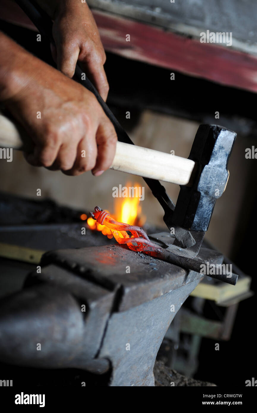 Making a decorative pattern on the anvil Stock Photo - Alamy