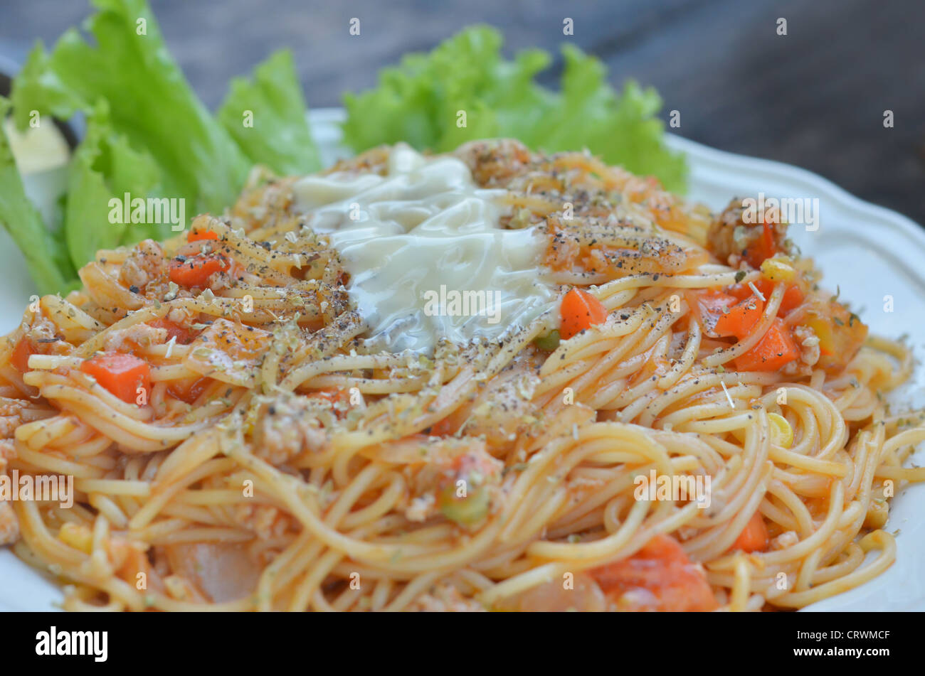 pasta with tomato sauce and meat , served with fresh vegetable Stock