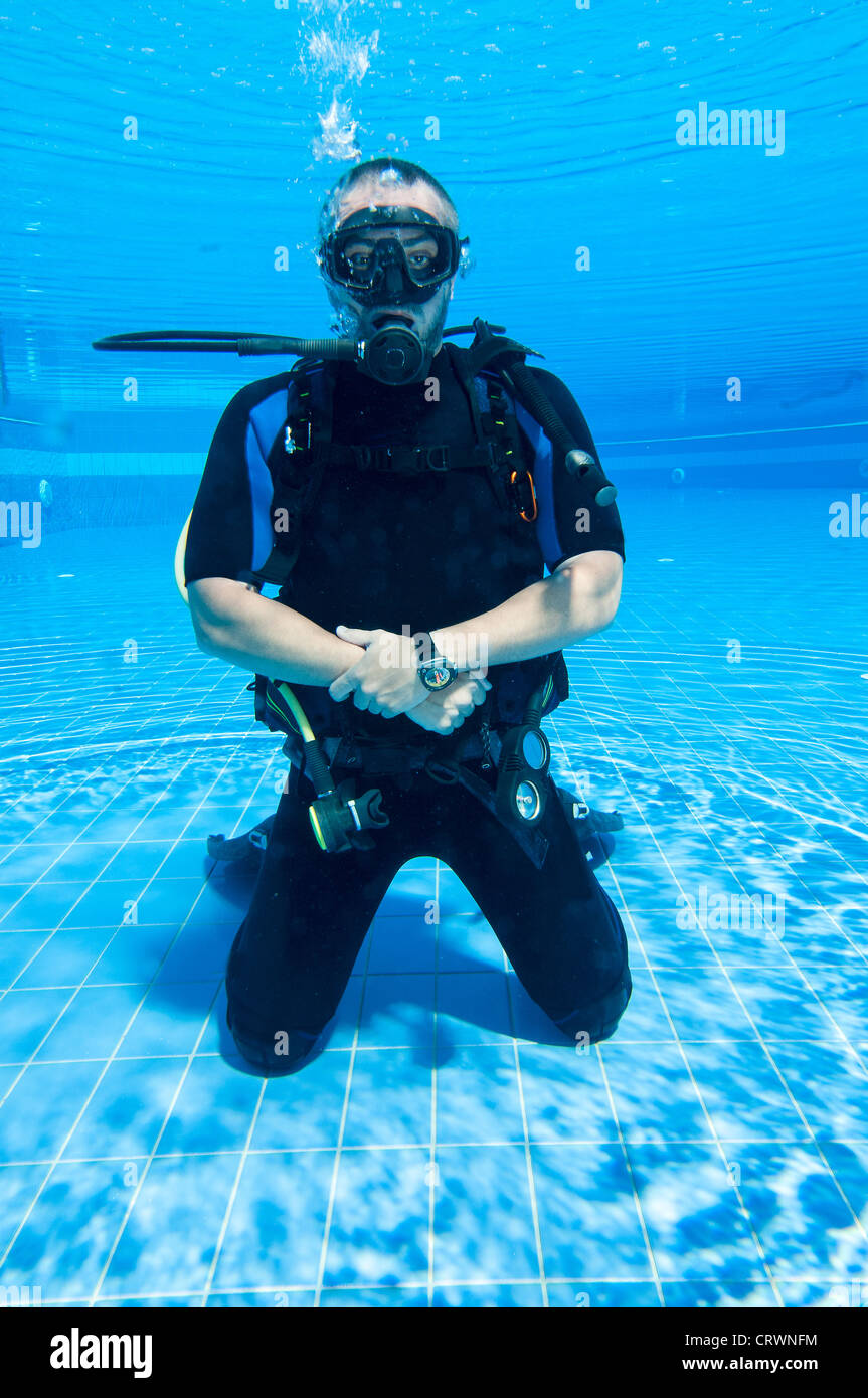 Scuba diver training in a pool Stock Photo