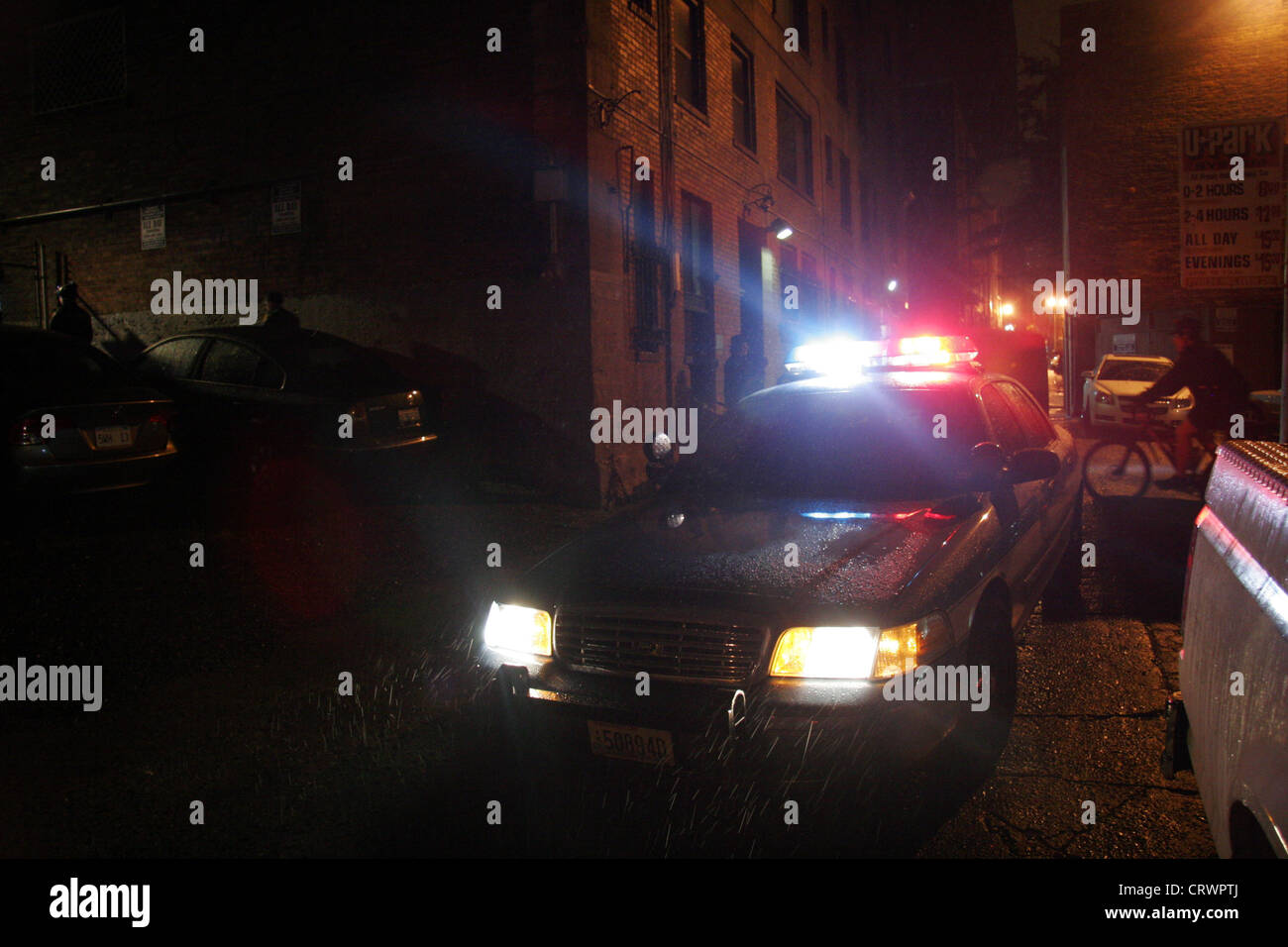 Seattle police car in a back alley in the rain. Stock Photo