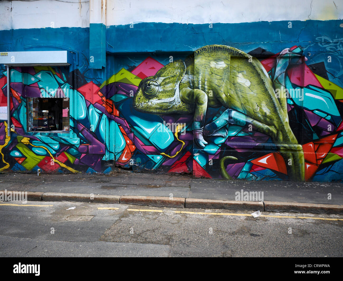 Cameleon graffiti on wall in Liverpool UK Stock Photo