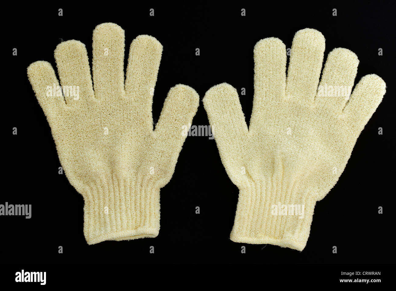 Pair of yellow exfoliating gloves Stock Photo