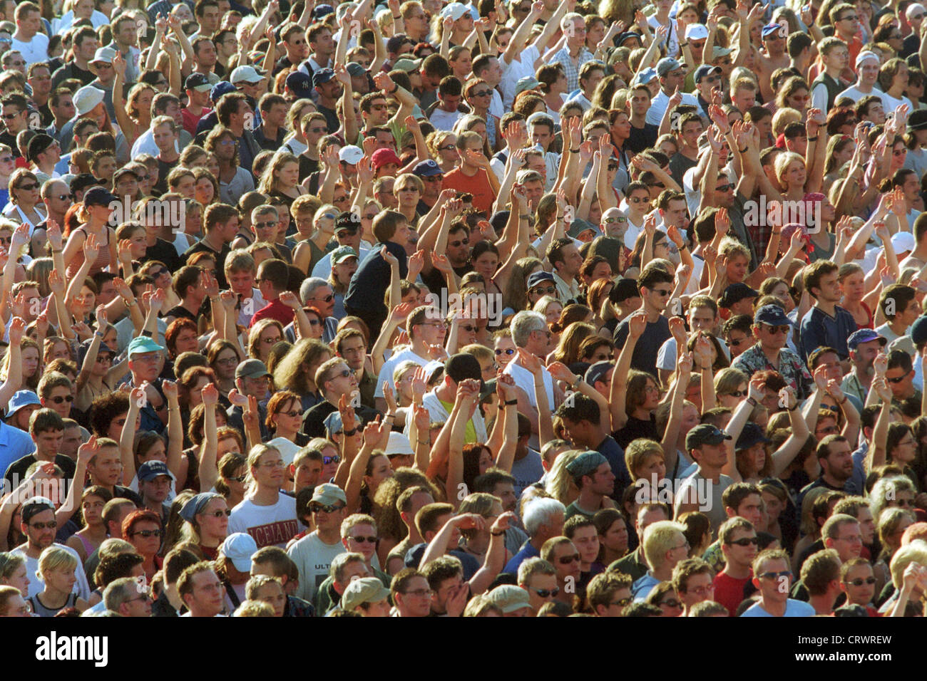 A crowd while celebrating on an open air event Stock Photo