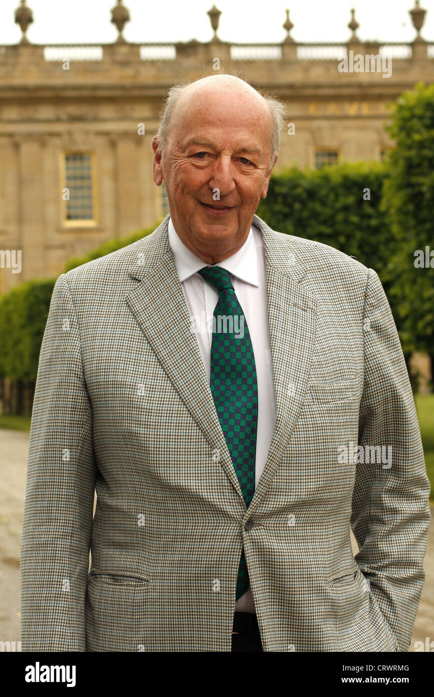 Peregrine Cavendish,12th Duke of Devonshire on South Lawn against backdrop  of south facade of Chatsworth House, Derbyshire, UK Stock Photo - Alamy