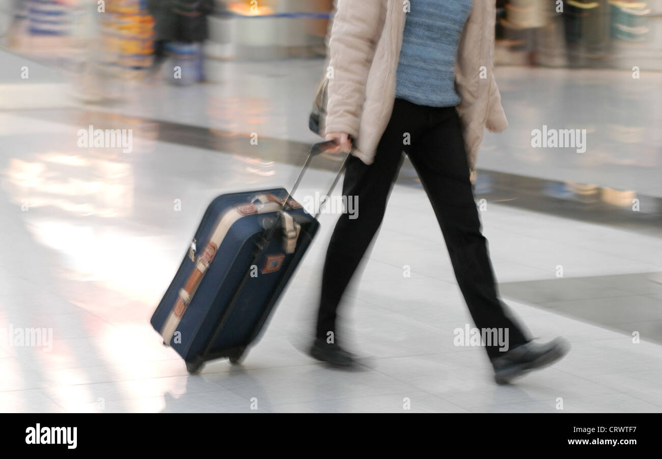 Person with luggage Stock Photo