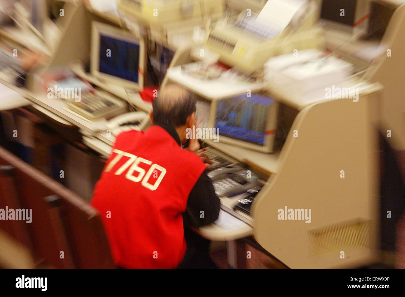 Dealer at work in the Stock Exchange of Hong Kong Stock Photo