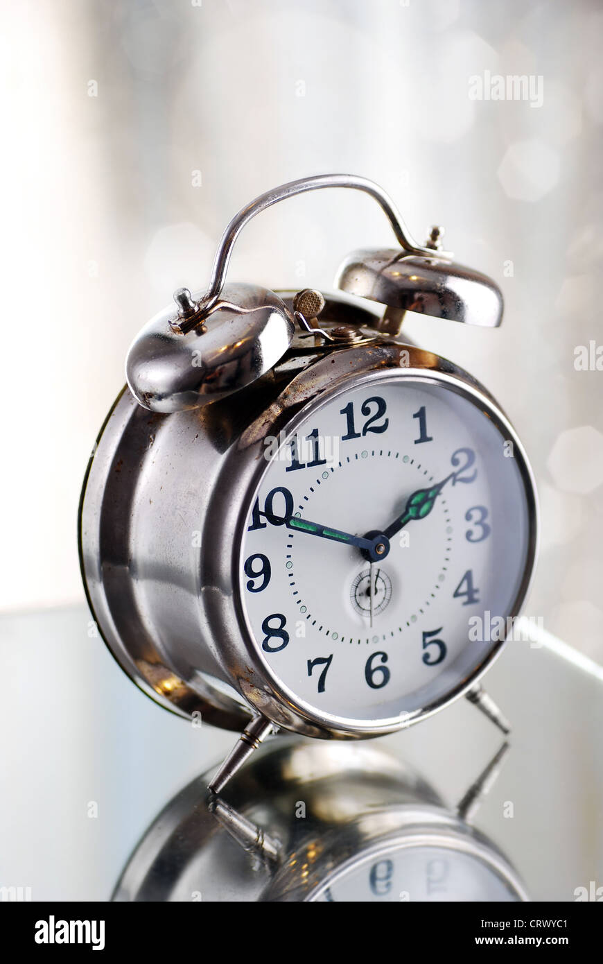 Old fashion alarm clock in the morning light Stock Photo Alamy