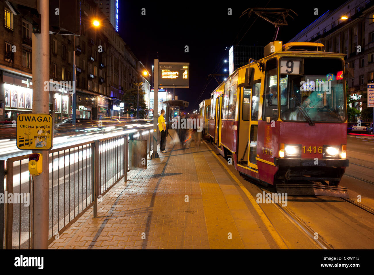 A tram travelling through the centre of Warsaw and night. Poland. Stock Photo