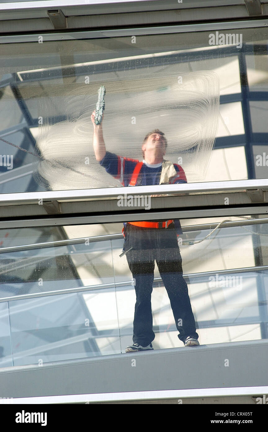 Window cleaner wipes window in the Reichstag in Berlin Stock Photo - Alamy