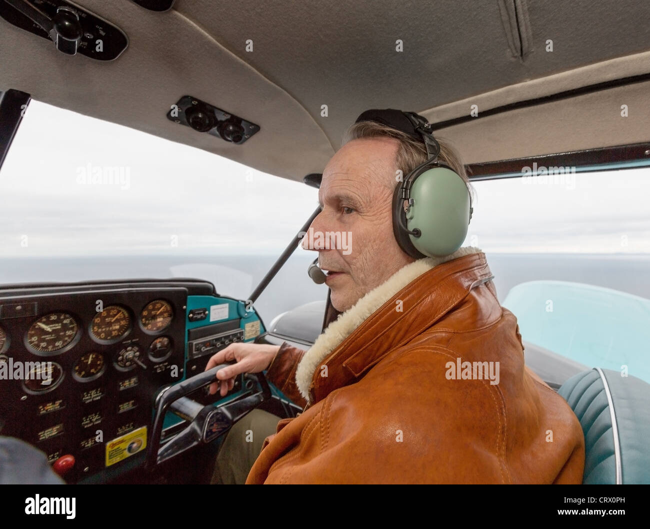 Co-Pilot flying the Piper PA-23 a twin-engine monoplane. First named Apache and later Aztec. Stock Photo