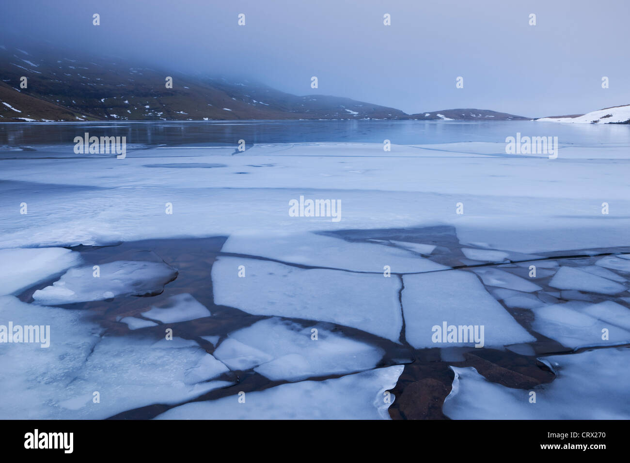 Broken ice on the surface of Llyn y Fan Fawr in the Black Mountain, Brecon Beacons National Park, Wales. Stock Photo