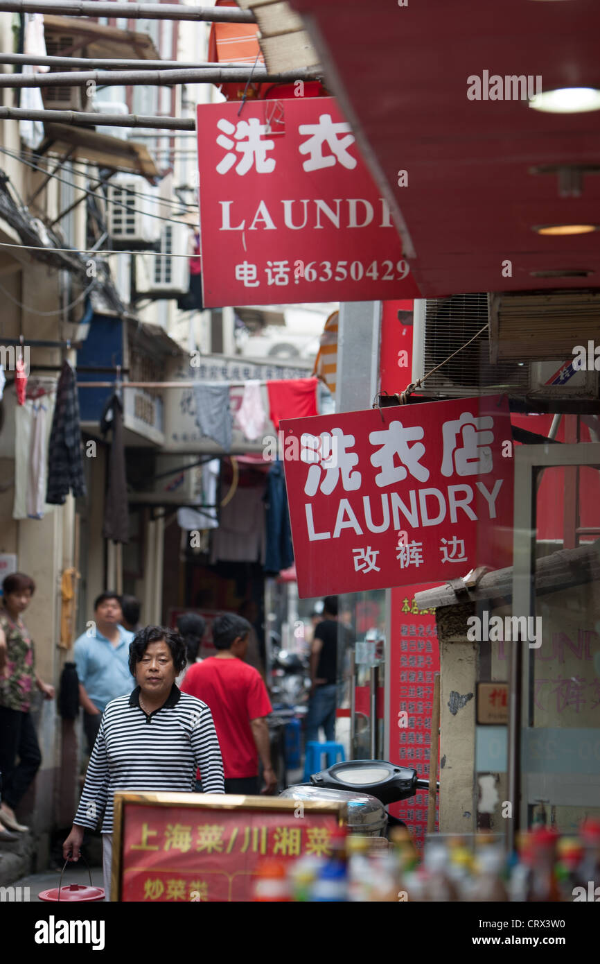Laundry businesses Nanjing Road area, in Shanghai, China Stock Photo