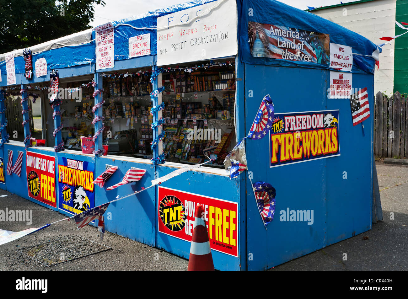 A colorful fireworks stand is open for business for those who want to celebrate American's Independence Day with dazzling light. Stock Photo