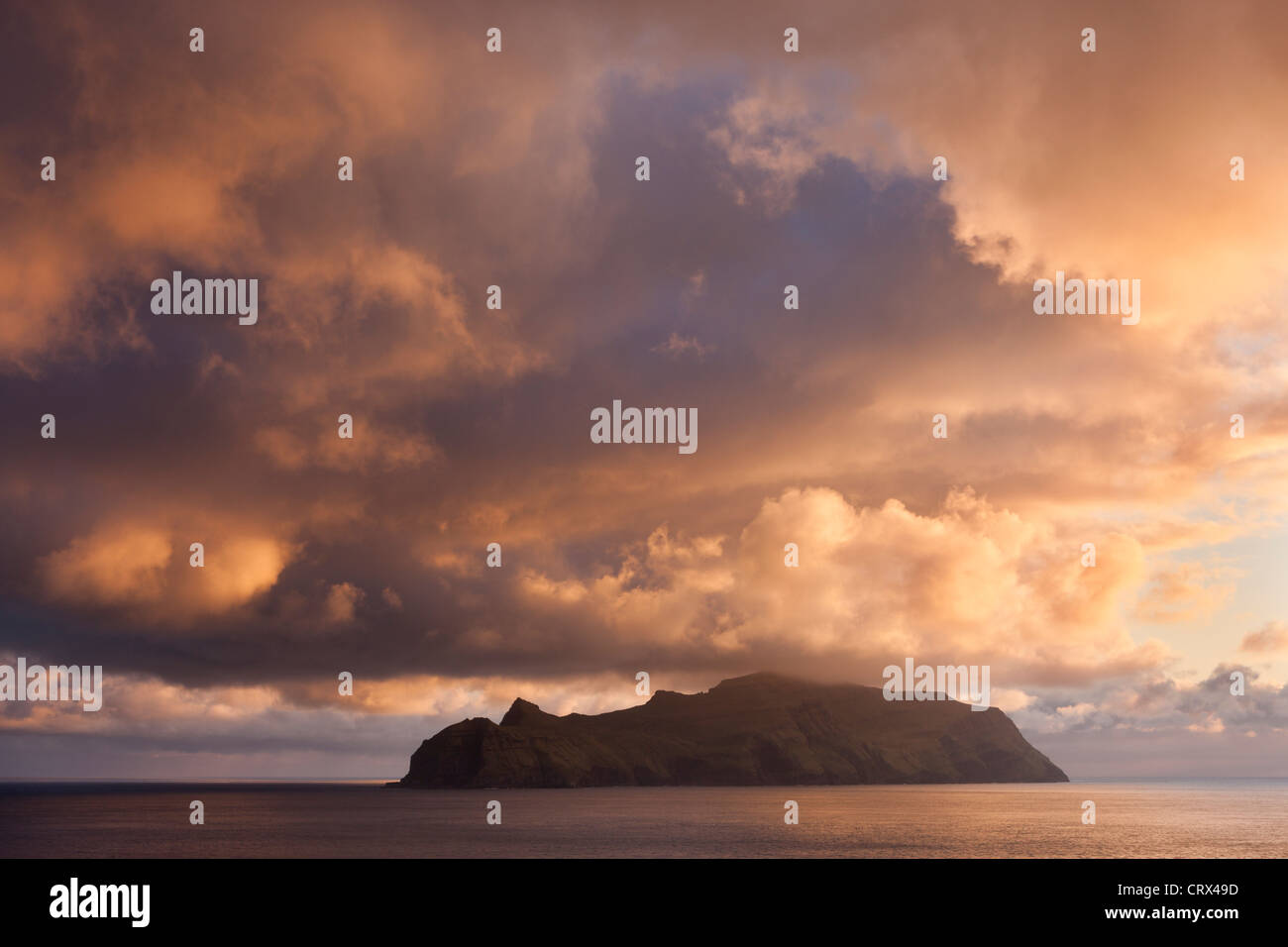 Spectacular sunset skies above the island of Mykines, Faroe Islands. Spring (May) 2012. Stock Photo