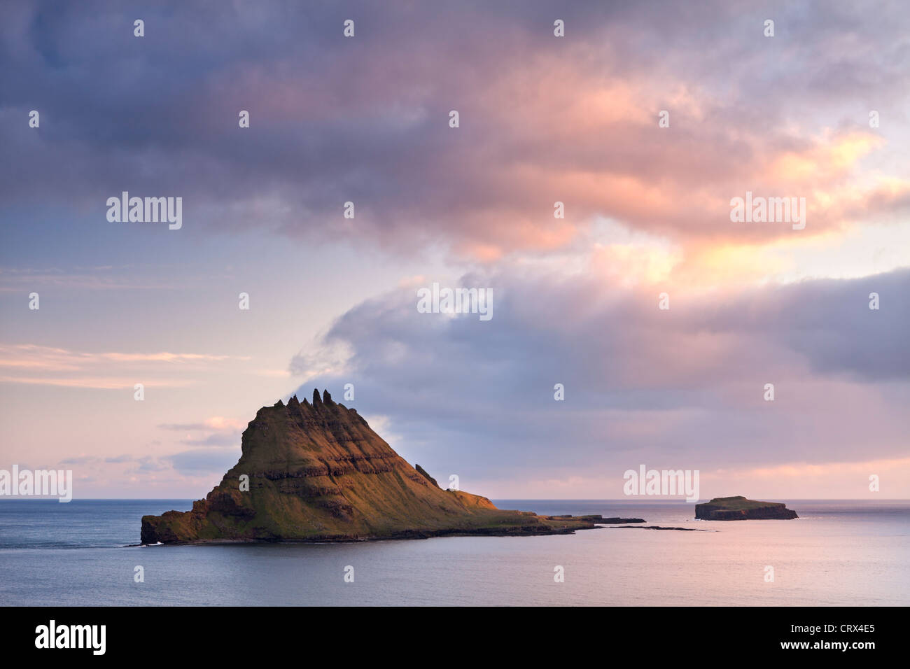 The islet of Tindholmur at the mouth of Sorvagsfjordur, Vagar Island, Faroes Islands. Spring (June) 2012. Stock Photo