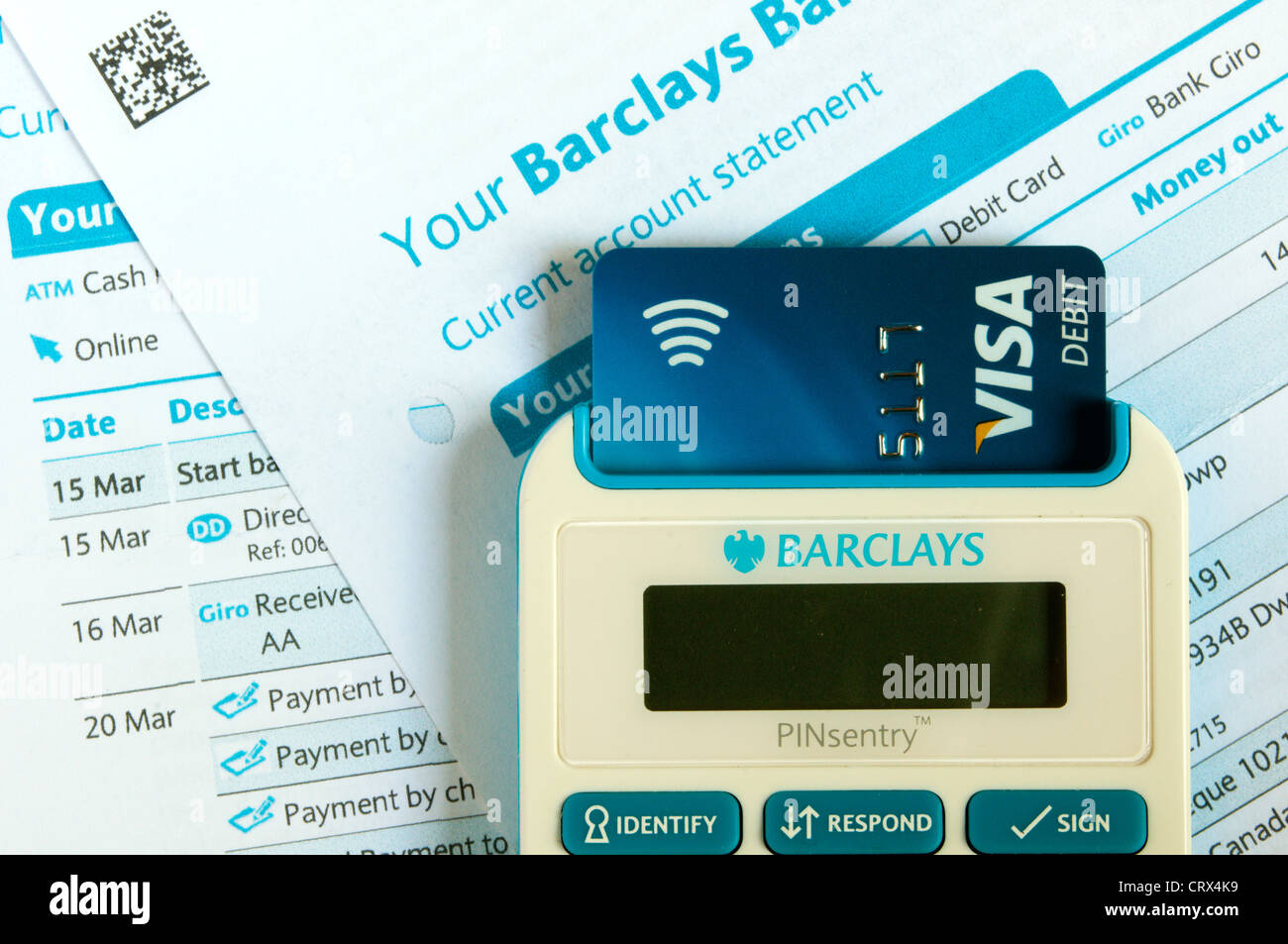 A Barclays passcode authentication PINsentry device reading a chip and pin card to verify identity. On Barclays bank statements. Stock Photo