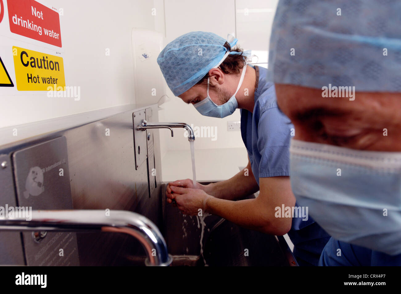 Two surgeons scrub up before an operation Stock Photo Alamy