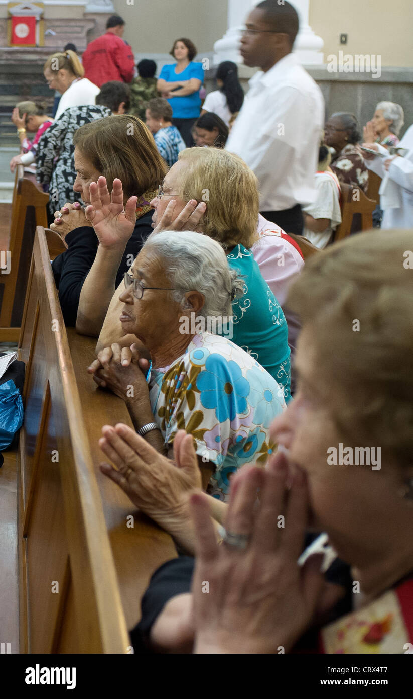 Catholicism Women pray in catholic church, Nova Friburgo cathedral, Rio de Janeiro State, Brazil. Stock Photo