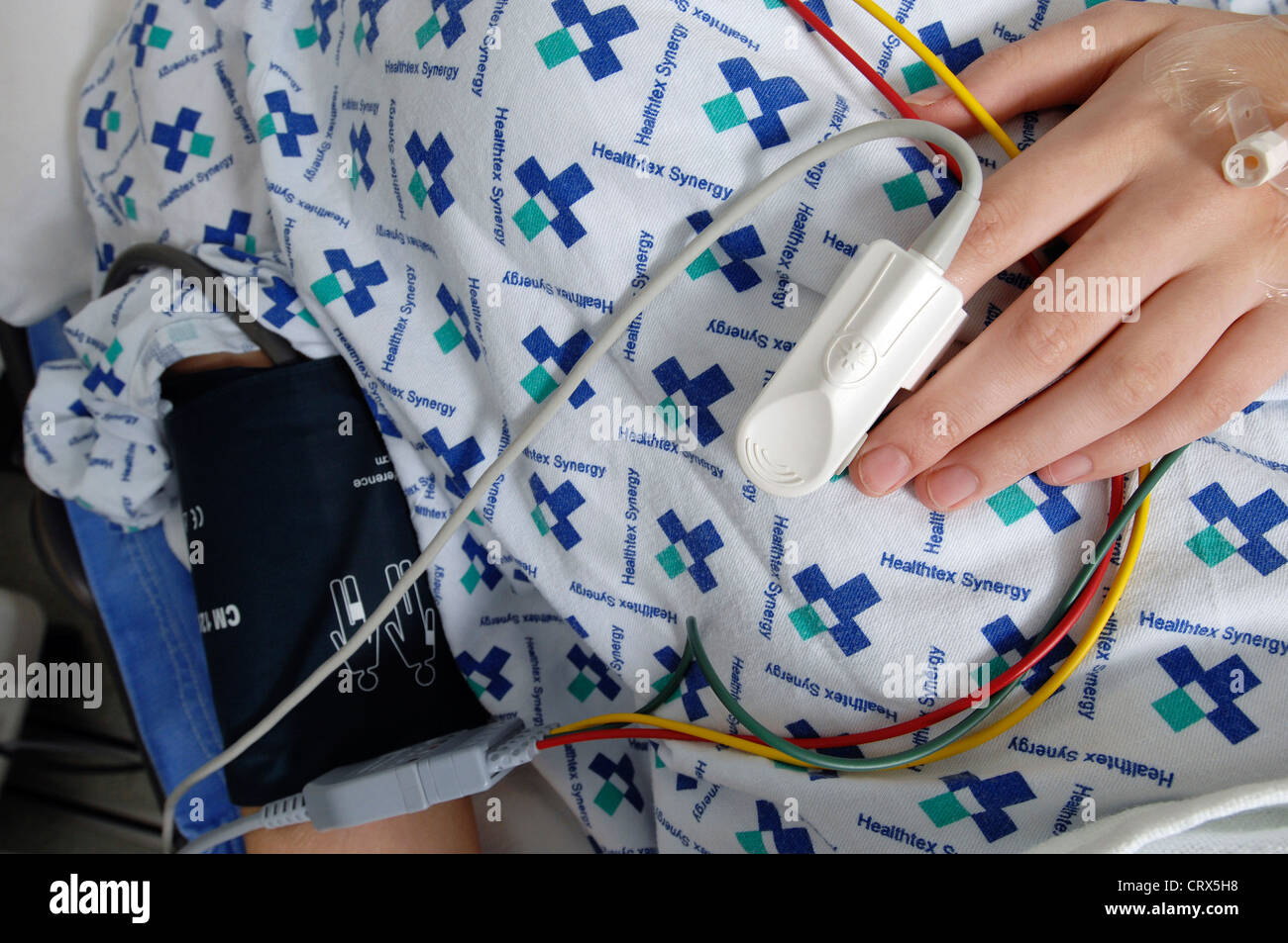 A patient's heart rate being monitored by a pulse oximeter Stock Photo ...